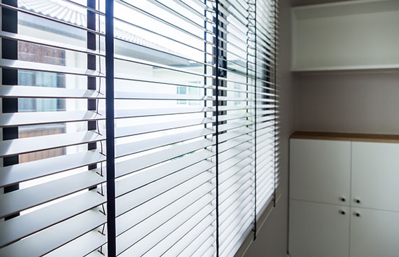 Lowering Wooden Blinds