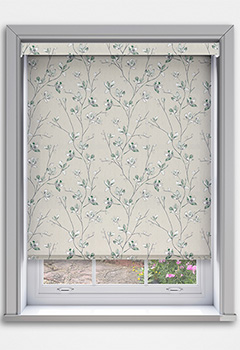 Memento Twilight Blockout with Cassette - The Memento Twilight Blockout Cassette Roller Blind features a beautiful green floral pattern on a light beige fabric with a plain off white backing, bringing natural elegance to any room. Custom-made for a perfect fit, it includes a 70mm cassette fascia with fabric inserts as standard or plain finishes in white, black, or anthracite. The blockout fabric offers superior light control and privacy, ideal for bedrooms or living spaces. A fabric-wrapped bottom bar provides a sleek touch, while the optional Grip Fit bracket ensures easy, no-drill recessed installation.
