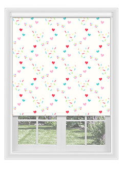Chorley White - Blackout blind with confetti & hearts in shades of light pink and blue. Available with a white plastic or chrome chain.
