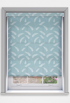 Sephora Azure Dimout with Cassette - The intricate patterned fern print of the Sephora Azure Dimout Cassette Roller Blind rests beautifully on a serene blue background, bringing a sense of calm and nature-inspired elegance to your space. Custom-made for a perfect fit, it gently filters light to create a soothing ambience. The blind includes a 70mm cassette fascia with a fabric insert as standard, with plain options in white, black, or anthracite. Finished with a fabric-wrapped bottom bar and an optional no-drill Grip Fit bracket for effortless recess installation, it&rsquo;s both stylish and practical.
