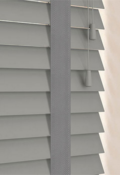 Pavilion 50mm Basswood & Shadow Tape - Revamp your living space with our uniquely crafted Pavillion 50mm & Shadow Tape wooden blinds in a fashionable mid-grey hue. Designed with 50mm wide basswood venetian slats and ornate tape, these blinds provide superior control over light and ensure privacy. A perfect fit for any room in your home.
