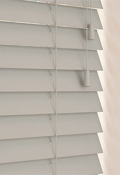 Marlin 50mm Basswood - Revamp your space with our elegant light grey stained wooden blind, crafted from sustainable wood. This custom-made blind features a 50mm slat width with colour-coordinated ladder cords for a touch of sophistication.
