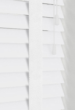 Native White Gloss & White Tape - This bright white faux wood blind has a high shine gloss effect and is manufactured with high-quality materials, easy to clean and ideal for any room in the home including bathrooms & kitchens. A custom made 50mm slat width, with white tape for maximum style.
