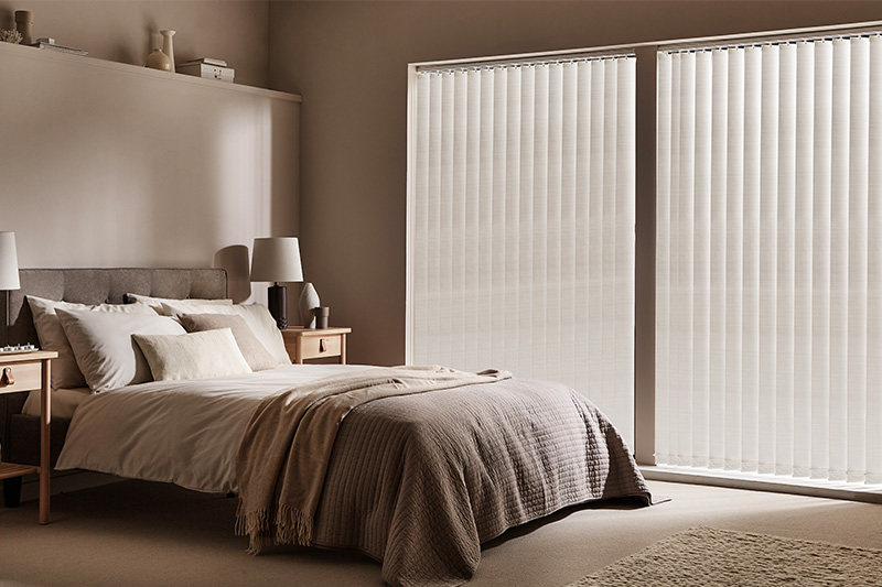 Help Keep Out The Light & Heat with Blackout Vertical Blinds